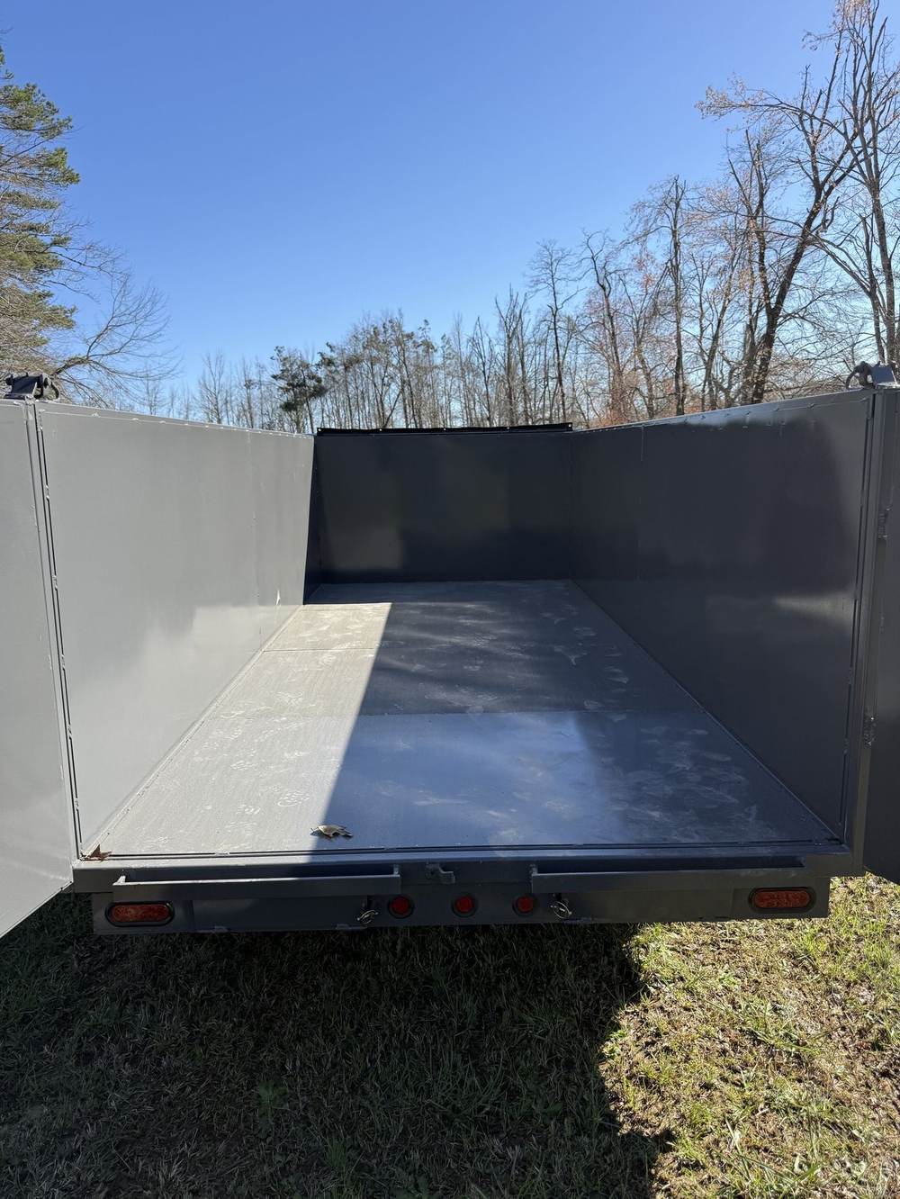 Smooth steel floor inside a Triple R dump trailer bed