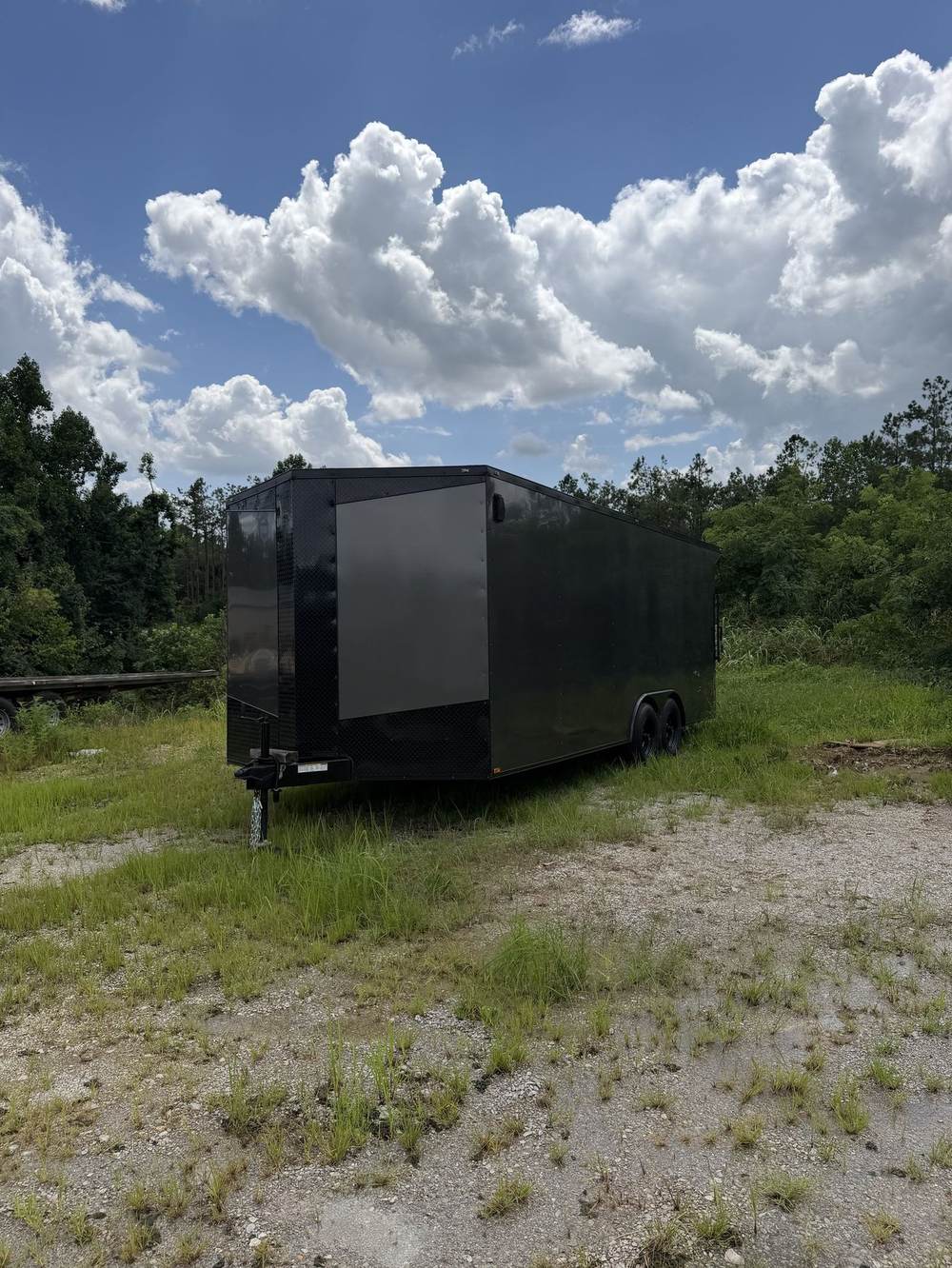 Black Triple R enclosed cargo trailer