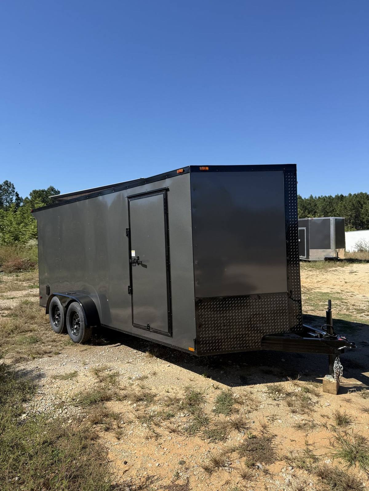 Charcoal Triple R enclosed cargo trailer with the Black Out trim package