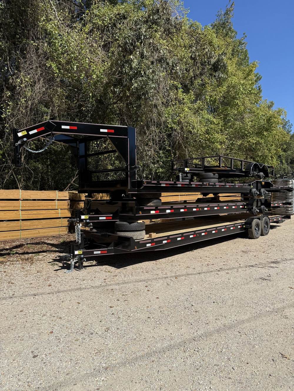 Gooseneck trailer loaded with lumber at the factory