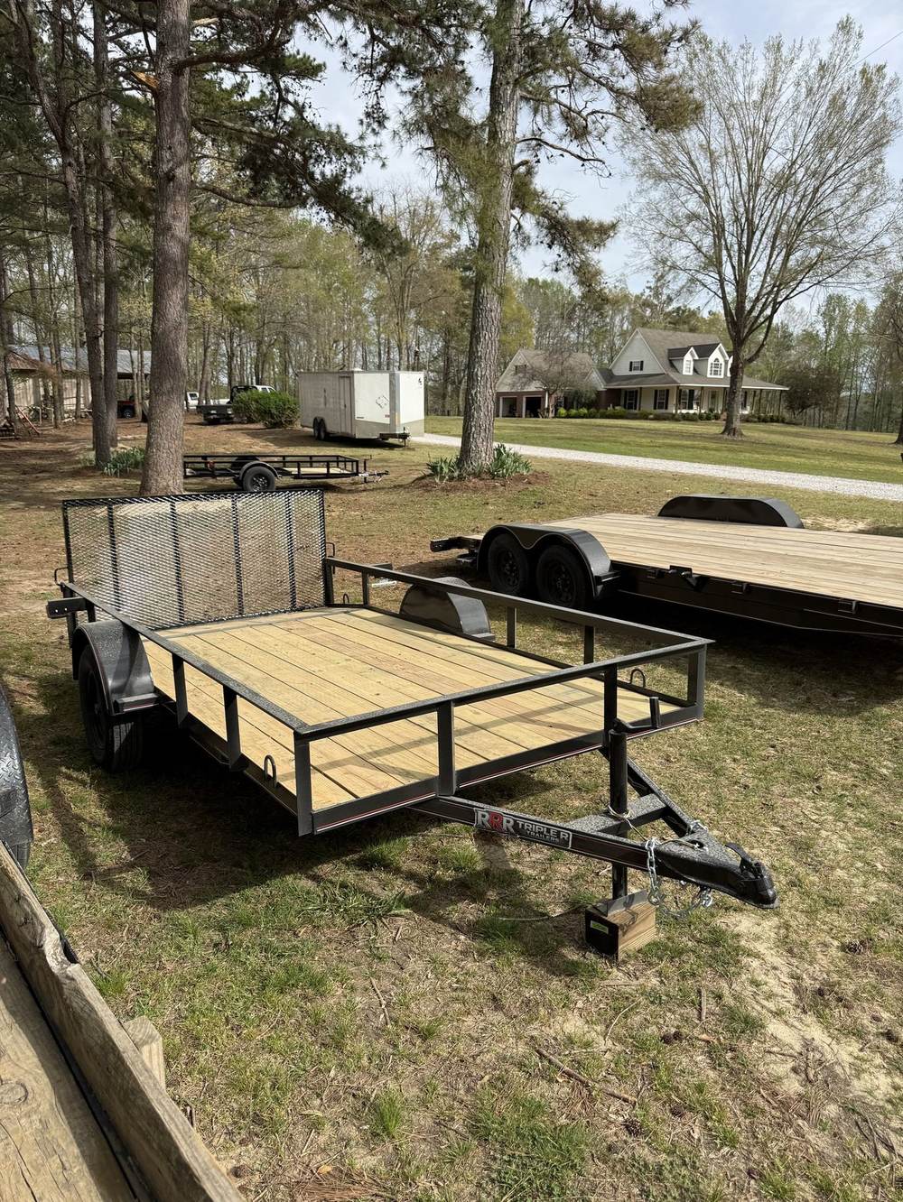 Triple R utility trailer with fresh treated wood deck and mesh gate